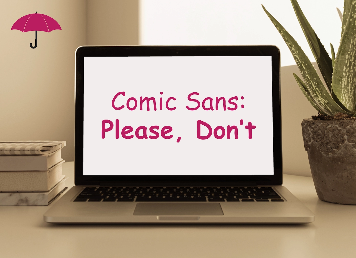 laptop computer on a neatly-organized desk with the text Comic Sans: Please, Don’t on the screen